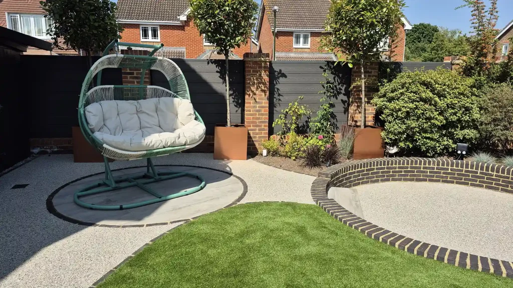 Hammack on small circular porcelain paving set in contemporary garden