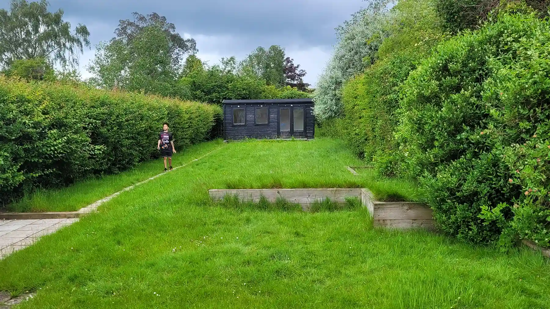 Large old lawn with summer house.