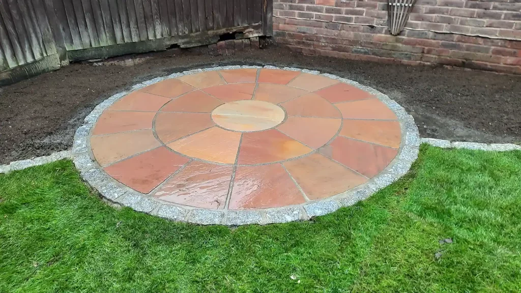 Raj blend sandstone patio with granite edging.